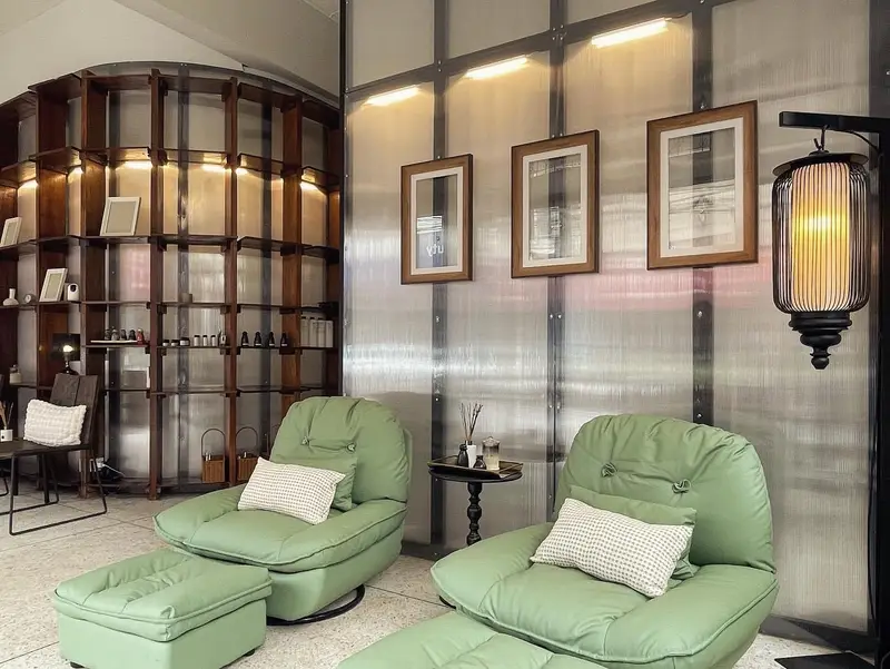 Foot massage lounge with framed pictures and a lantern